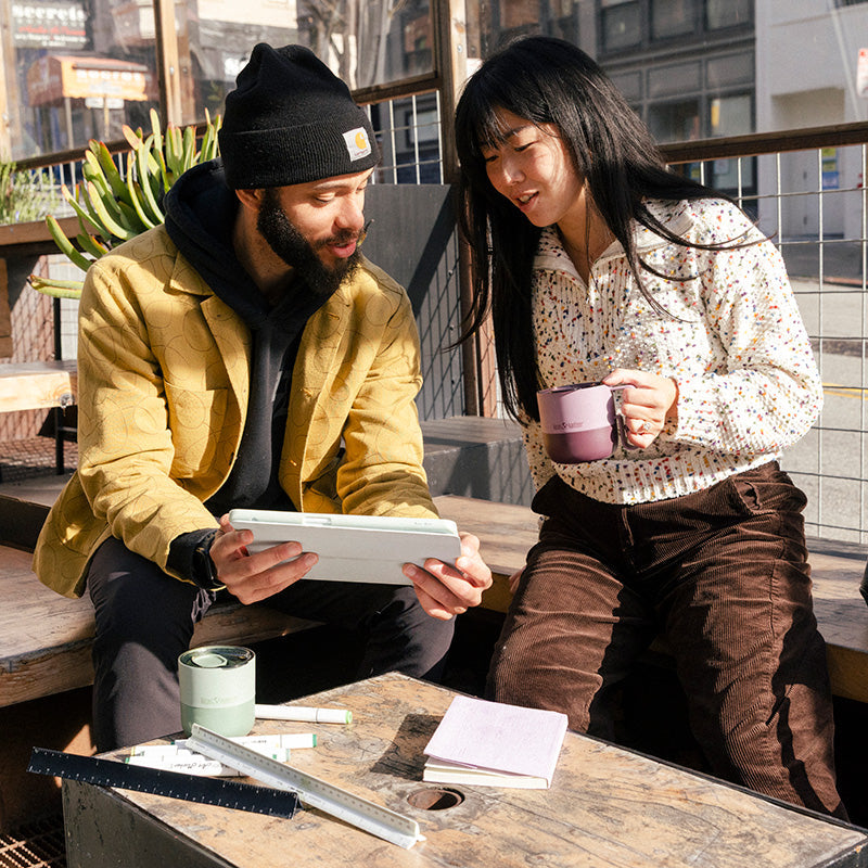 12oz-rise-mug-b2 12oz_rise_coffee_mug_dusty_orchid_couple_city_patio_square.jpg