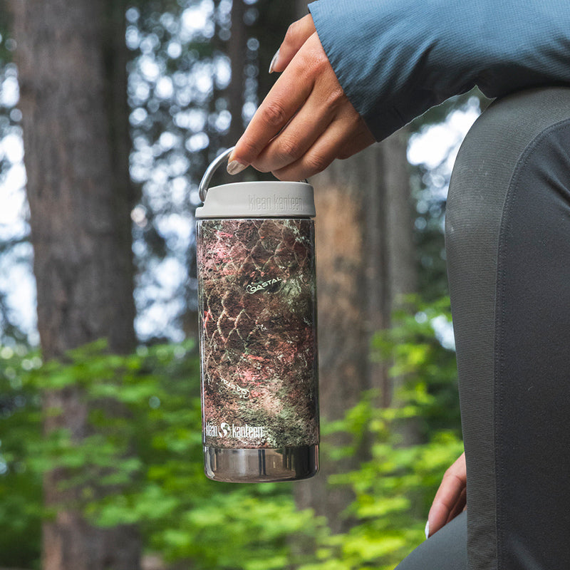 12oz-tkwide-with-twist-cap-mossy-oak-c2 12oz_tumbler_mossyoak_rainbowtrout_hand_closeup_square.jpg