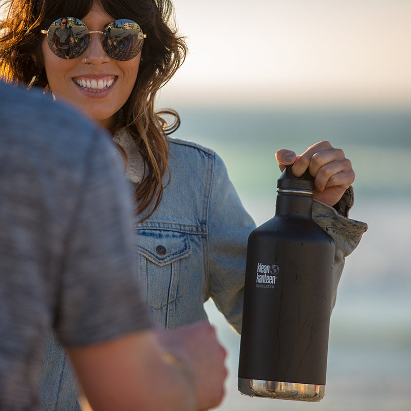 64oz-classic-with-loop-cap-n1 64oz_insulated_classic_black_beach_girl_hand_square.jpg